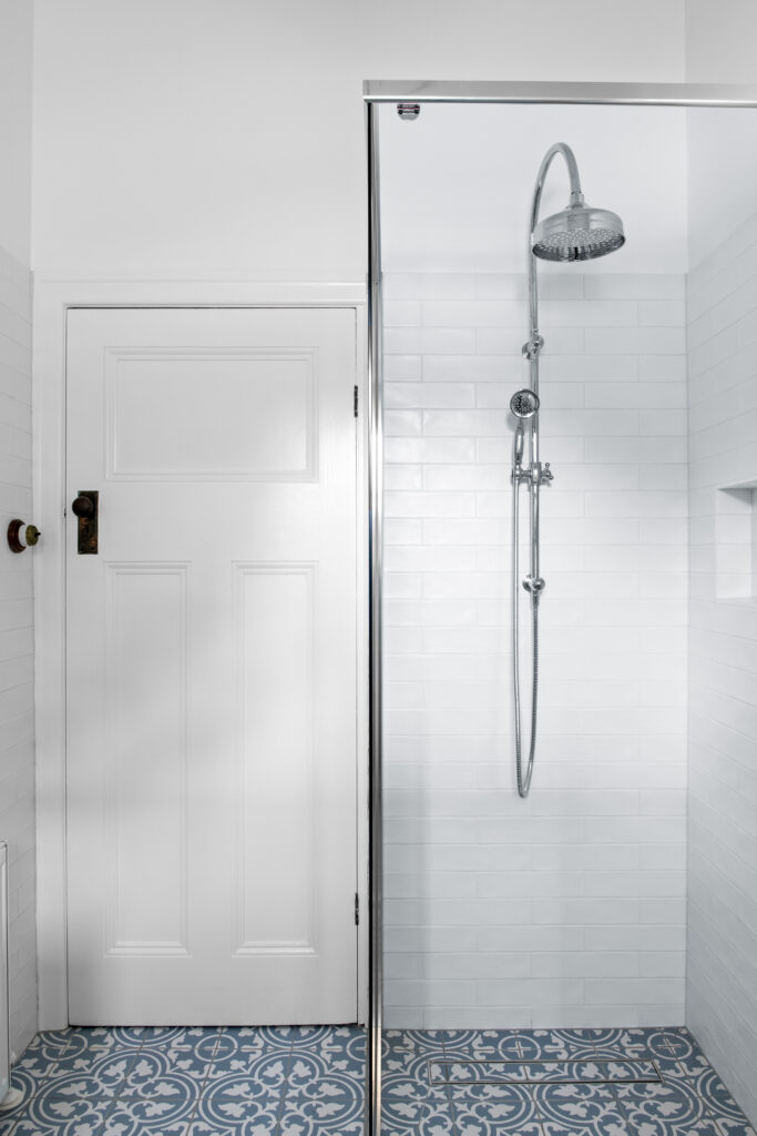 shower with two heads, black door handle, vintage light switch, decorative floor tiles 54 Garfield Road Garfield bathroom