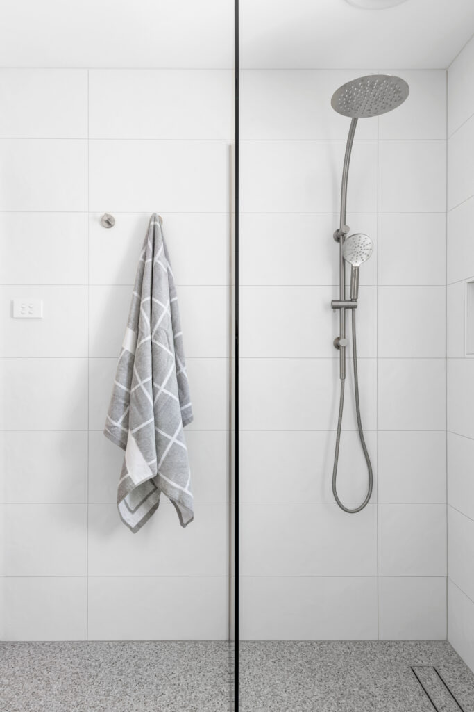 8 Constance Street Blackburn South Bathroom with 2 shower heads and grey towel hanging on hook