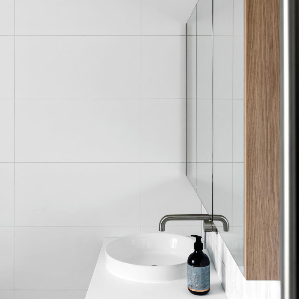 side view of 8 Constance Street Blackburn South Bathroom circular basin mirror cabinets on wall