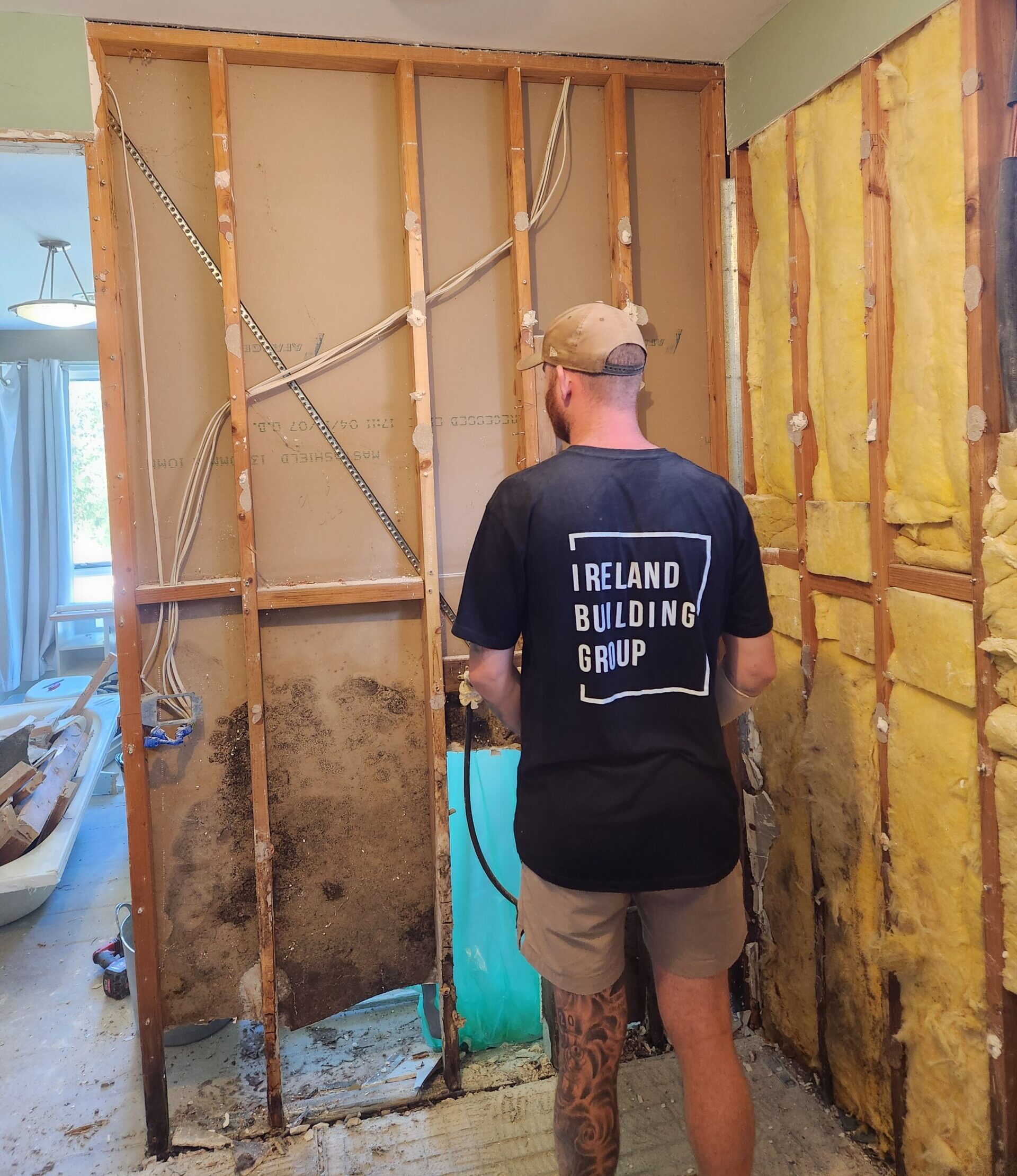Ireland building group in the renovation process, worker in Ireland Building Group work shirt