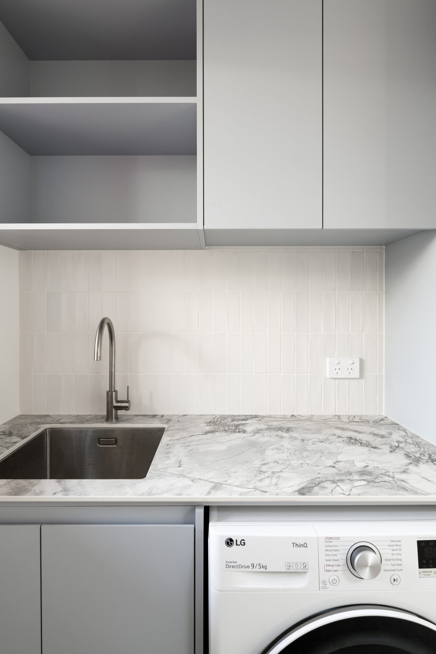 Sunderland Street Malvern East, laundry with marble bench top and dryer underneath