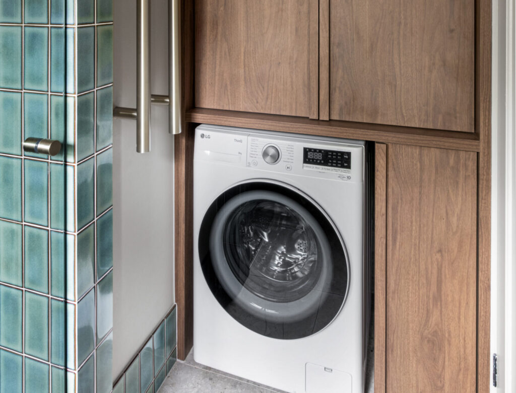 Mooltan Street Travencore, laundry with wooden cabinetry and a dryer built in